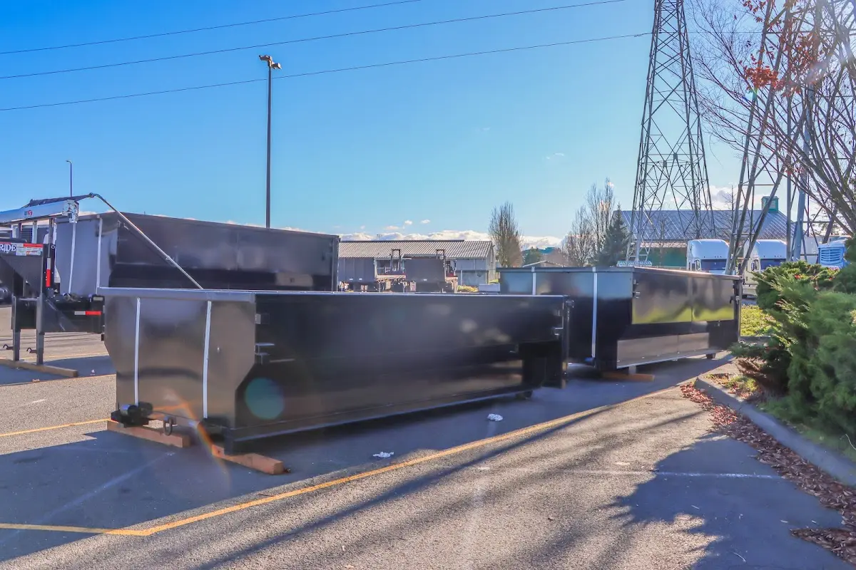 Roll-off dumpster ready for waste disposal at job site for 12 Yard Dumpster Rental in Ferry Pass